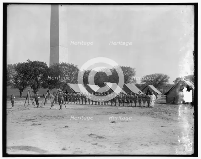 Military camp; base of Washington Monument, between 1910 and 1920. Creator: Harris & Ewing.