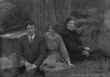 Millay, Edna St. Vincent, Miss, with Bliss Carman and George Sterling, seated against a tree, 1914. Creator: Arnold Genthe