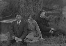 Millay, Edna St. Vincent, Miss, with Bliss Carman and George Sterling, seated against a tree, 1914. Creator: Arnold Genthe
