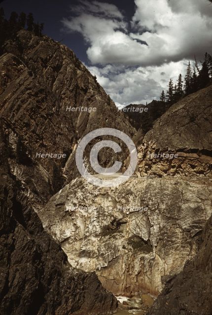 Million dollar highway [U.S. 550] is cut through massive rocks in Ouray County, Colorado, 1940. Creator: Russell Lee.