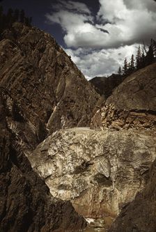 Million dollar highway [U.S. 550] is cut through massive rocks in Ouray County, Colorado, 1940. Creator: Russell Lee