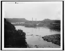 Mills from railroad bridge, Eau Claire, Wis., between 1880 and 1899. Creator: Unknown