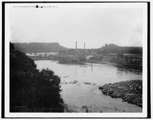 Mills from railroad bridge, Eau Claire, Wis., between 1880 and 1899. Creator: Unknown