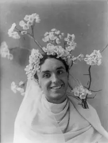 Mills Thompson, head-and-shoulders portrait, facing right, with cherry..., between c1890 and c1910. Creator: Frances Benjamin Johnston