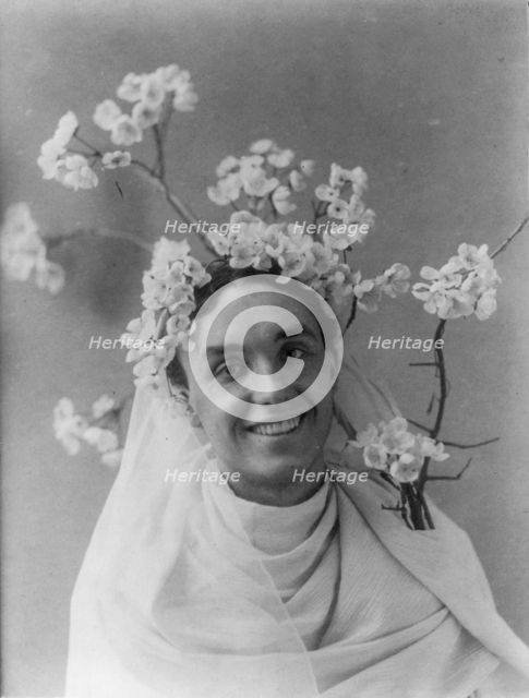 Mills Thompson, head-and-shoulders portrait, facing right, with cherry..., between c1890 and c1910. Creator: Frances Benjamin Johnston.