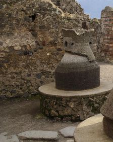 Millstone in the pistrinum, (bakery), Pompeii, Italy, 2009. Creator: LTL
