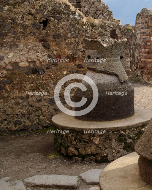 Millstone in the pistrinum, (bakery), Pompeii, Italy, 2009.  Creator: LTL.