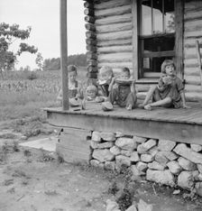 Millworker's children eating watermelon on porch..., Person County, North Carolina, 1939. Creator: Dorothea Lange