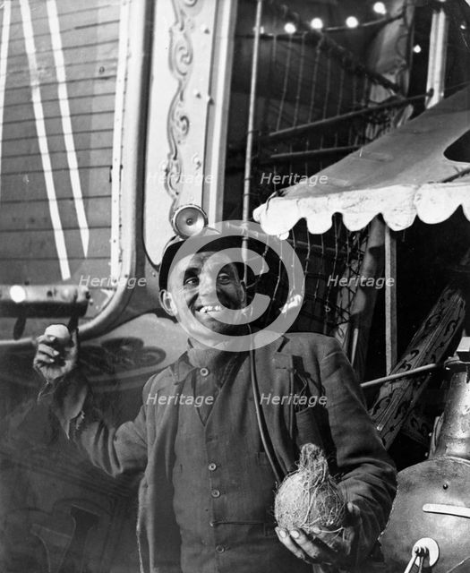 Miner at a fairground, Conisbrough, near Doncaster, South Yorkshire, 1955. Artist: Michael Walters