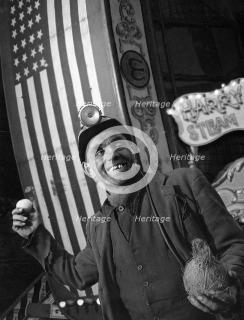Miner at a fairground, Conisbrough, near Doncaster, South Yorkshire, 1955. Artist: Michael Walters