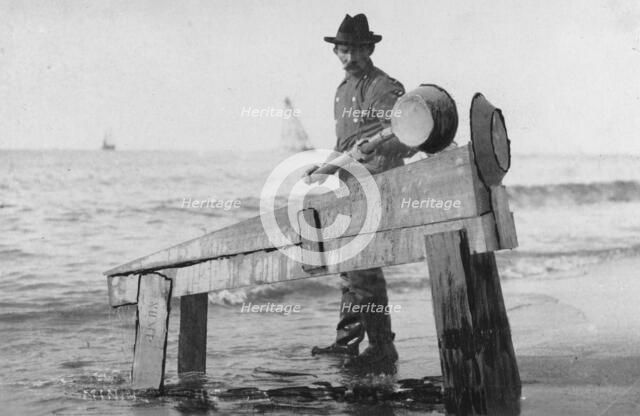Miner washing gold, between c1900 and c1930. Creator: Unknown.