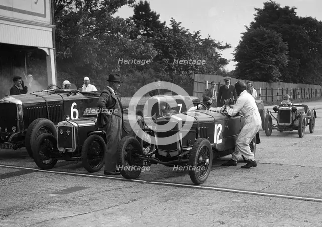 Minerva, Austin and Alvis at the start of an Inter-Club Meeting, Brooklands, 20 June 1931. Artist: Bill Brunell.