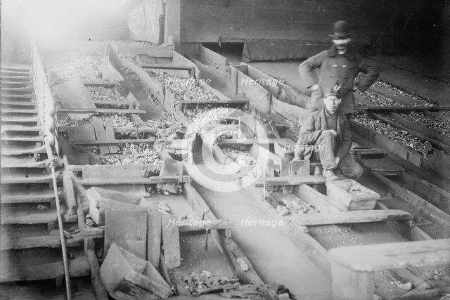 Miners among coal boxes, S. Wilkes-Barre, PA., 1912. Creator: Bain News Service.
