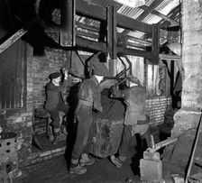 Miners working in Mitchell Main Colliery near Barnsley, South Yorkshire, 1956. Creator: Michael Walters