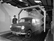 Mini van being washed in a car wash, Co-op garage, Scunthorpe, Lincolnshire, 1965. Creator: Michael Walters