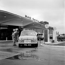 Mini on the 1959 Mobil Economy Run, re- fuelling. Creator: Unknown