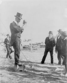 Minnesota State Fair: African American on soap box using hand puppet, 1900?. Creator: Unknown