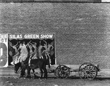Minstrel poster in Alabama town, 1936. Creator: Walker Evans