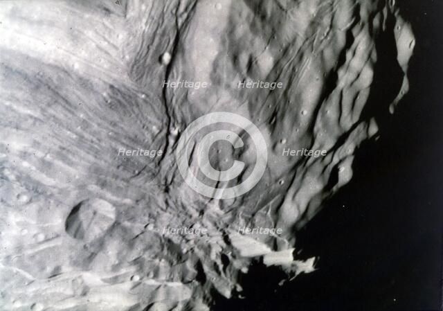 Miranda, one of the moons of Uranus, seen from Voyager 2, 24 January 1986. Creator: NASA.