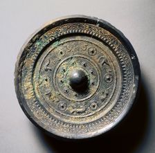 Mirror with Concentric Circles, an Immortal, and Auspicious Animals, 1st century. Creator: Unknown