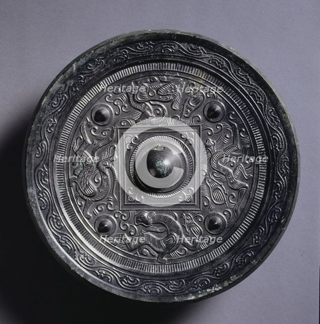 Mirror with a Central Square, an Immortal, and Auspicious Animals, 2nd century. Creator: Unknown.