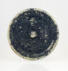 Mirror with dragon and tiger design, 0-199. Creator: Unknown