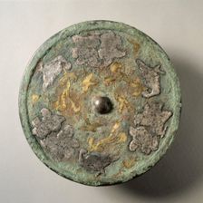Mirror with Flowers and Birds in Gold and Silver Cutouts over a Lacquer Base, mid 8th century. Creator: Unknown