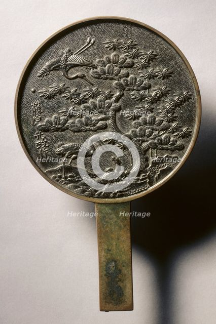 Mirror with Handle, Decorated with Pine Tree and Crane, early 17th - mid 19th century. Creator: Unknown.