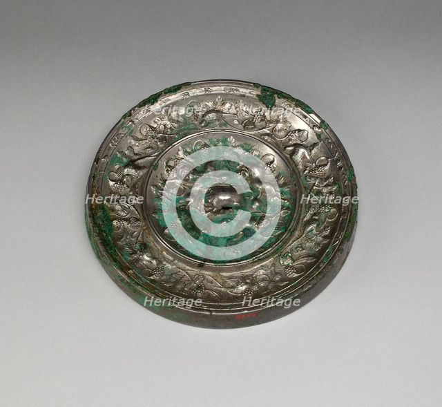 Mirror with "Lion and Grapevine" Design, Tang dynasty (A.D. 618-907), 8th century. Creator: Unknown.