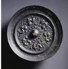 Mirror with Three Pairs of Pixie around a Loti-form Knob, mid 600s . Creator: Unknown