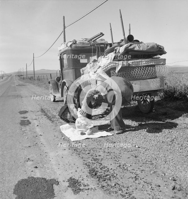 Missouri family of five on U.S. Highway 99 near Tracy, California, 1937. Creator: Dorothea Lange.