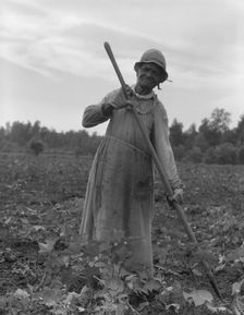 Mississippi Negress hoeing cotton, 1937. Creator: Dorothea Lange