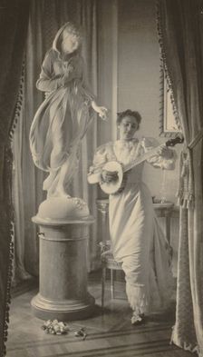 "Miss Apperson" playing banjo...Sen. George Hearst's residence, Washington, D.C., 1895. Creator: Frances Benjamin Johnston