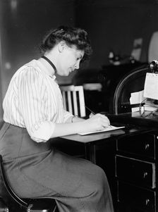 Miss Carolyn B. Sheldon at Desk, 1914. Creator: Harris & Ewing