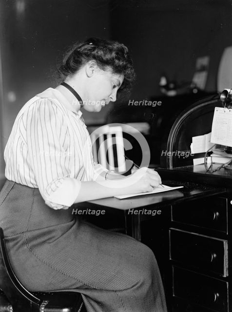 Miss Carolyn B. Sheldon at Desk, 1914. Creator: Harris & Ewing.