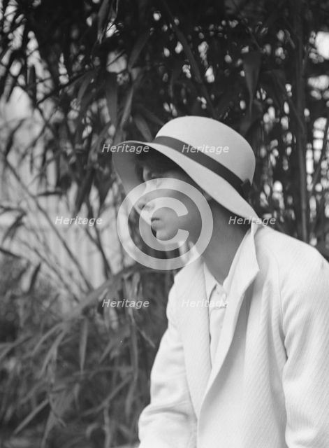 Miss Harriet Taylor, seated outdoors, 1932. Creator: Arnold Genthe.