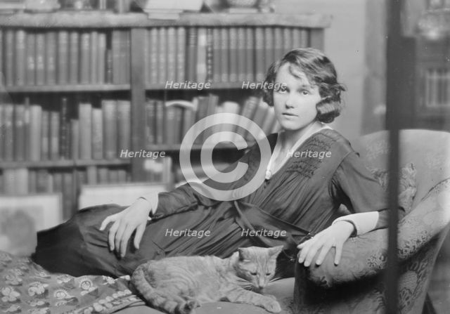 Miss Helen Chamberlain, with Buzzer the cat, portrait photograph, 1918 May 28. Creator: Arnold Genthe.