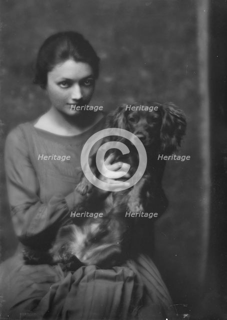 Miss Katharine Cornell, with dog, portrait photograph, 1917 Nov. 20. Creator: Arnold Genthe.