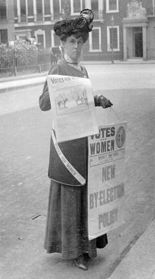 Miss Kelly selling Votes for Women in central London, July 1911. Creator: Unknown