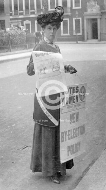 Miss Kelly selling Votes for Women in central London, July 1911. Artist: Unknown