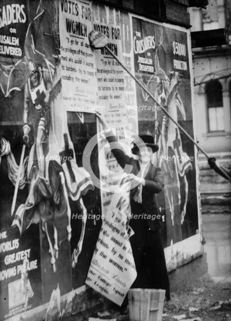 Miss Louise Hall with brush and Susan Fitzgerald assisting bill posting..., between c1910 and c1915. Creator: Bain News Service.