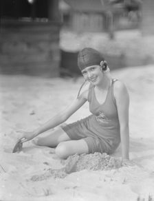 Miss Marguerite Churchill, at the beach, 1923 July. Creator: Arnold Genthe