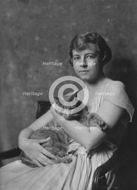 Miss Marjorie Cluett, with Buzzer the cat, portrait photograph, 1917 Dec. Creator: Arnold Genthe.