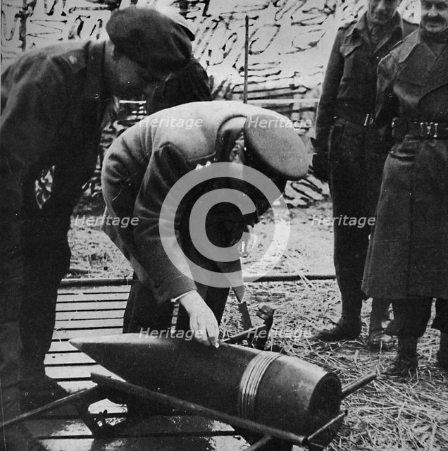 'Mr. Churchill autographing a present for Hitler', c1940s, (1945). Artist: Unknown.