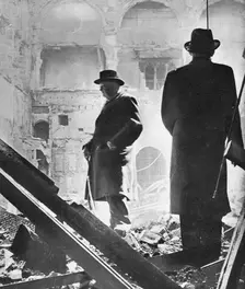 Mr. Churchill contemplates the ruins of the House of Commons, bombed in May 1941 1941
