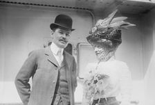 Mr. and Mrs. C.F. Bishop next to train, 1910. Creator: Bain News Service