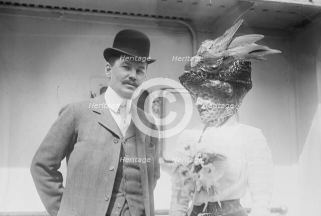 Mr. and Mrs. C.F. Bishop next to train, 1910. Creator: Bain News Service.