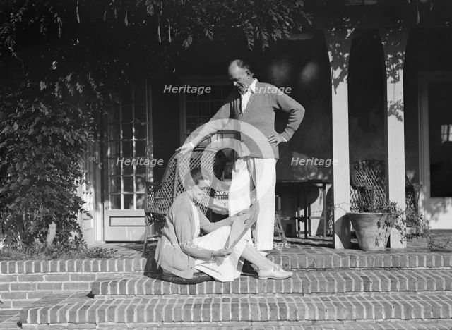 Mr. and Mrs. Hamilton King seated on the steps of their house, between 1911 and 1934. Creator: Arnold Genthe.