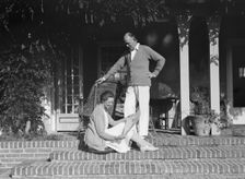 Mr. and Mrs. Hamilton King seated on the steps of their house, between 1911 and 1934. Creator: Arnold Genthe