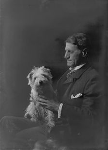 Mr. Arthur Young, with dog, portrait photograph, 1918 Oct. 1. Creator: Arnold Genthe